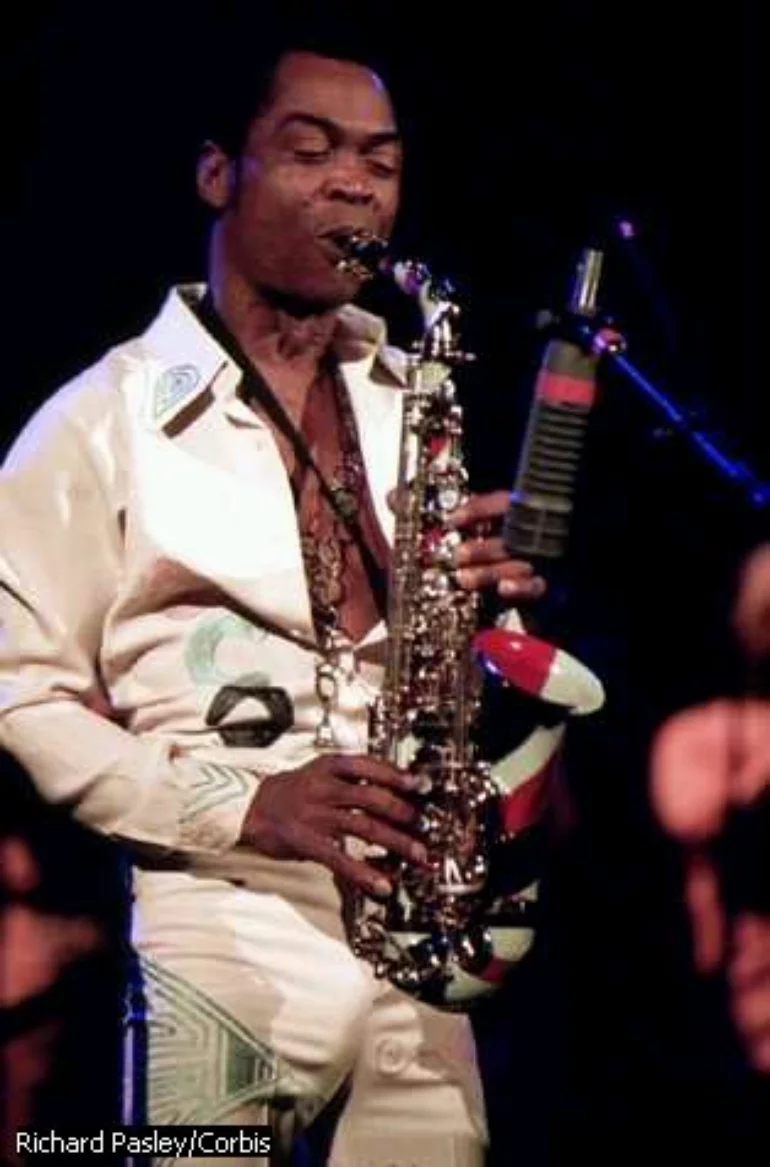 fela playing his sax at a concert